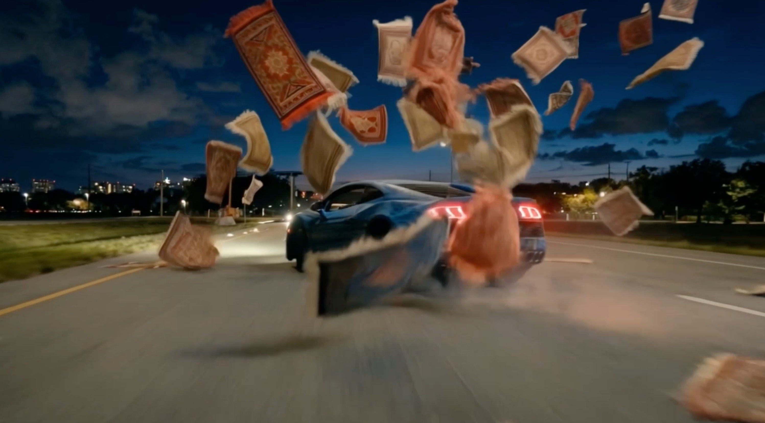 Rugs flying behind a speeding car
